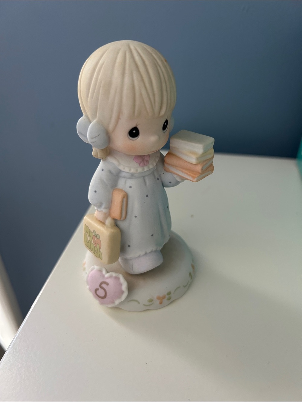 Precious Moments cream, white, pink figurine with pastel books